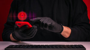 AI voice scam and deepfake fraud concept with cybercriminal using smartphone and smart technology tools. AI-generated deception, voice cloning attack, identity theft and digital financial crime.